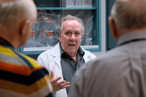 A photo of Dallas Legare, the Director of Laboratory Operations with Scimar, in Scimar's lab.